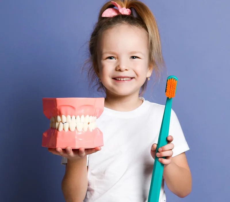 A pediatric patient recovering after a comfortable tooth extraction